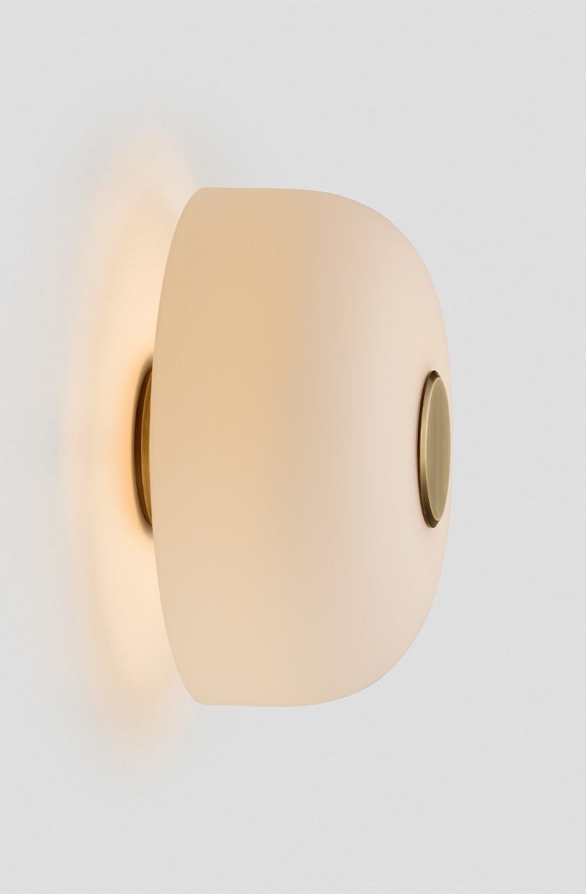 Articolo Studios Luxury Lighting Rolo Backward Facing Wall Sconce in brass and Snow Shade