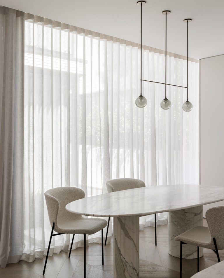Articolo Studios Luxury Lighting Fizi Triple Pendant in Dining Room of Raleigh Residence by Raad Group