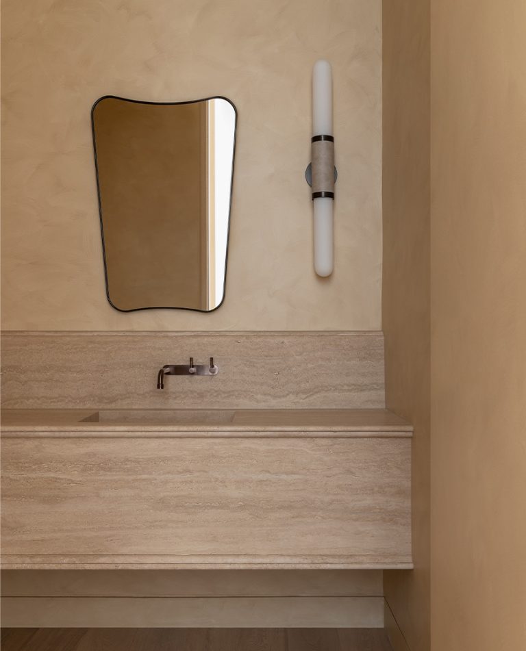 Articolo Studios Luxury Lighting Scandal Wall Sconce in the bathroom of House Caramel by CHJ Studio