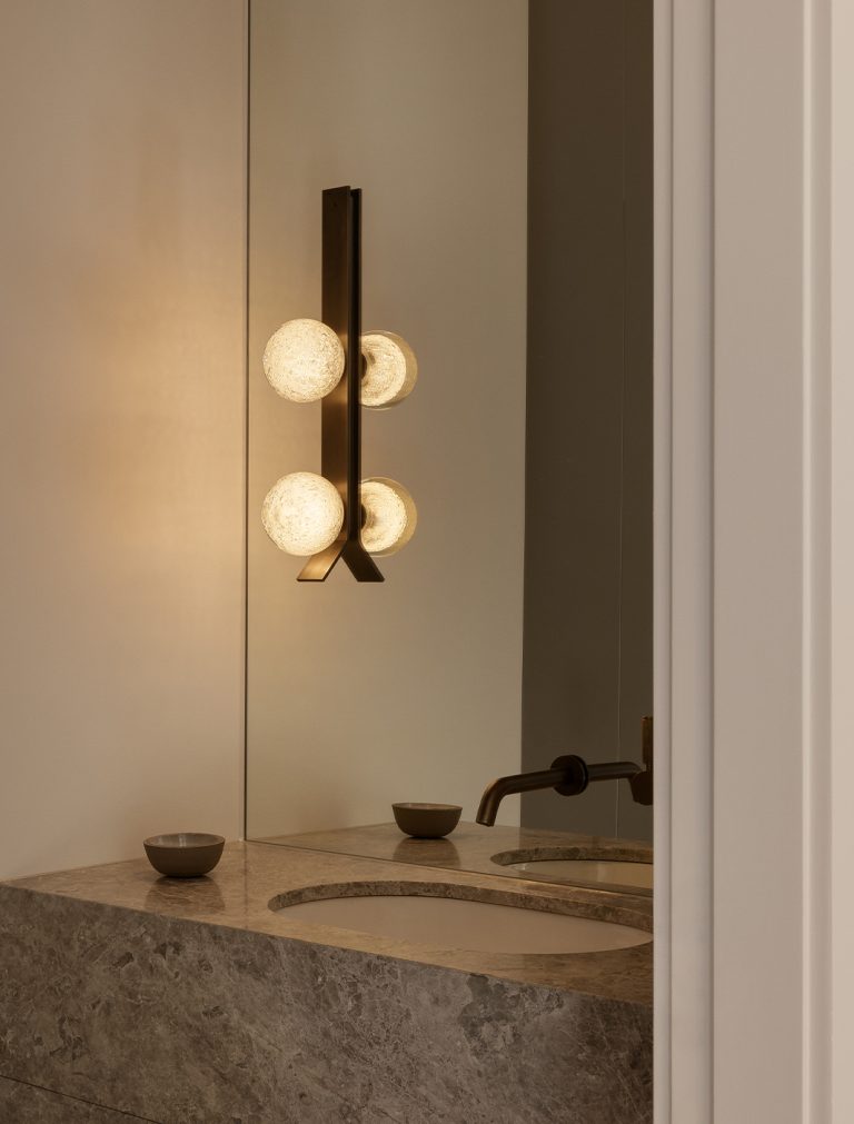 Articolo Studios Luxury Lighting Fizi on Kick Double Wall Sconce iin Bathroom of Two Tone House by Homeroom Studio