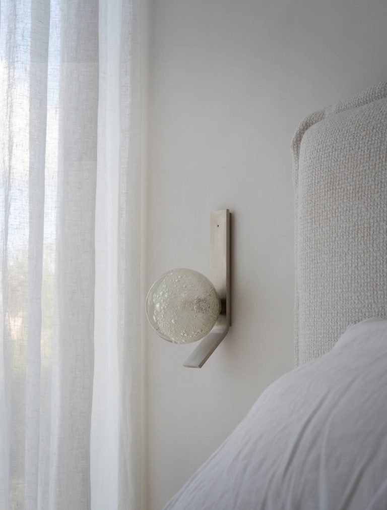 Articolo Studios Luxury Lighting Fizi on Kick Wall Sconce in Satin Nickel in Bedroom of King Residence by King Architecture